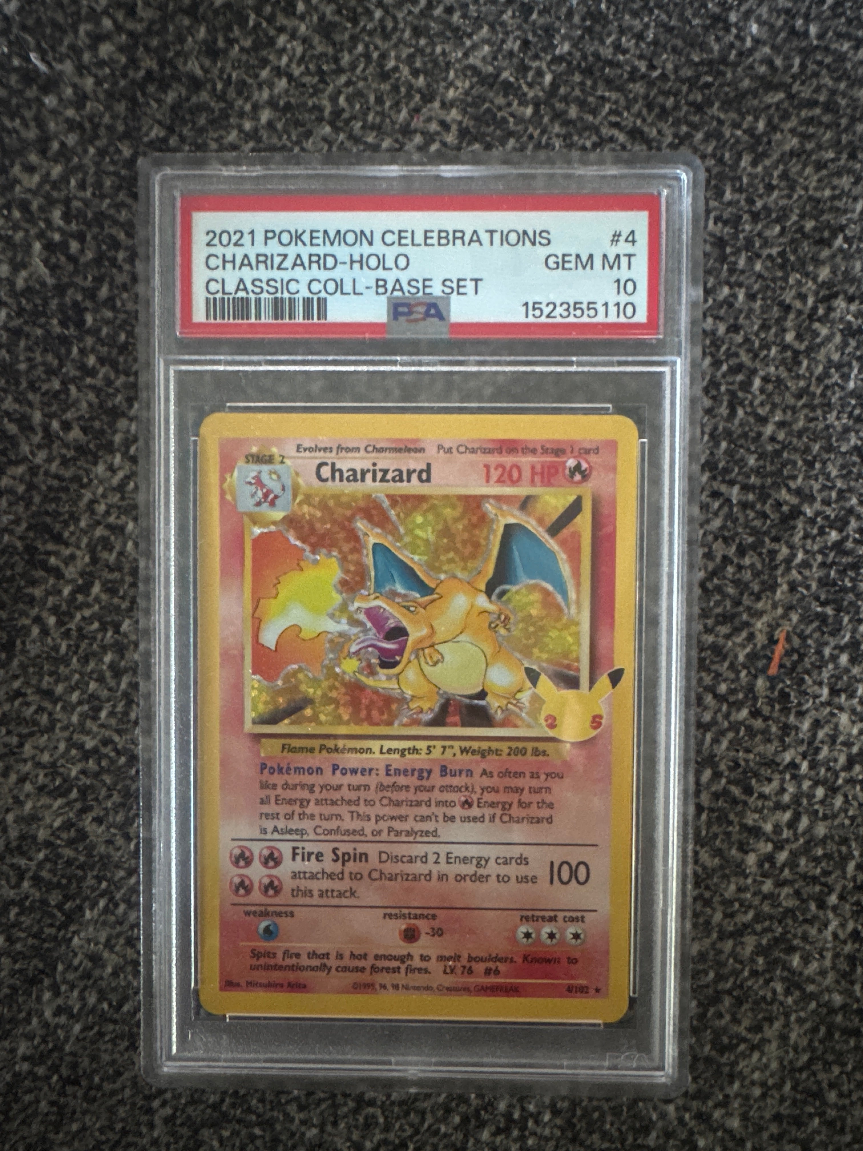 PSA-graded Celebrations Charizard in a slab with certification label above the card