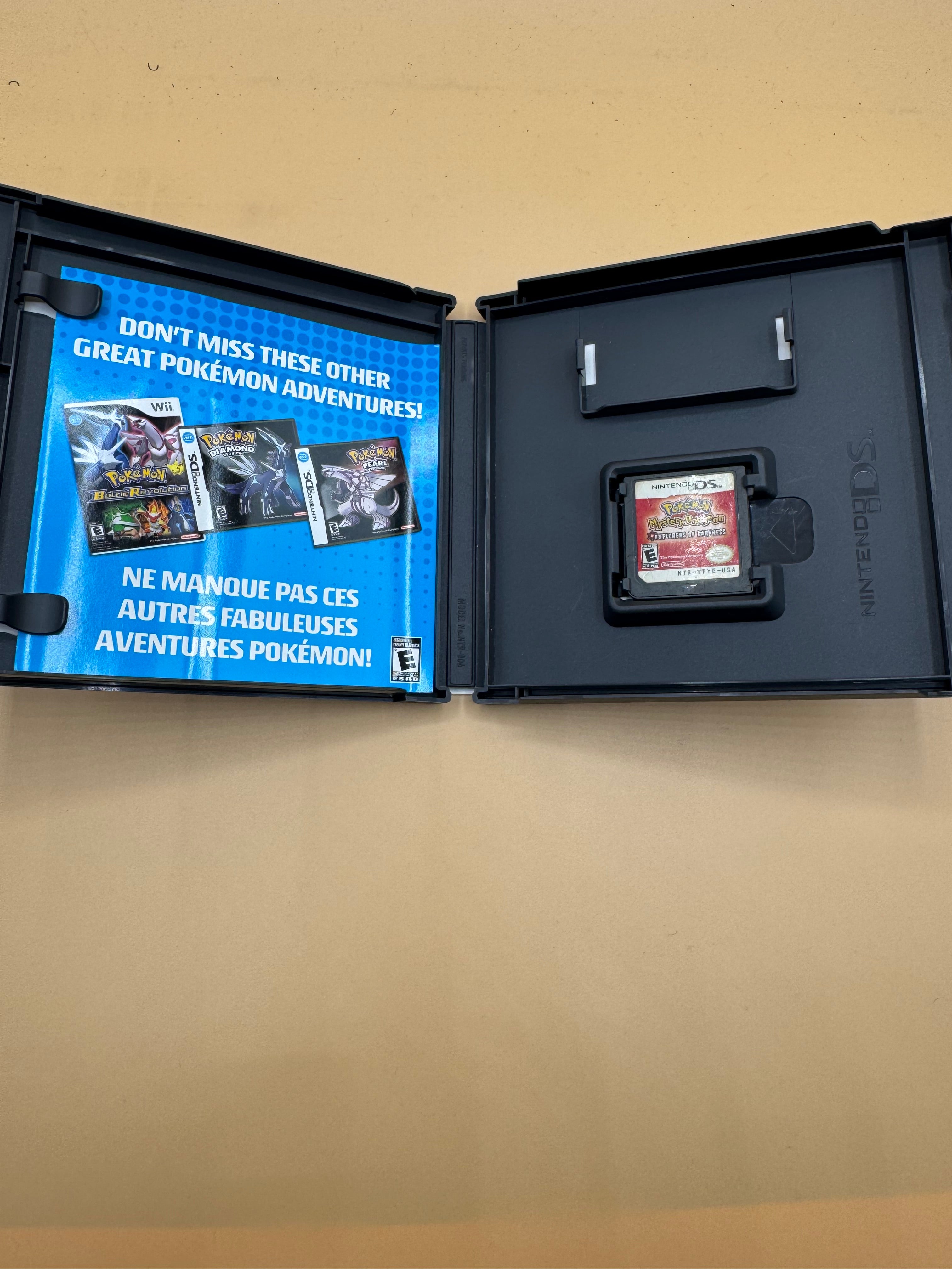 Open Pokémon Mystery Dungeon Explorers of Darkness case with manual and cartridge